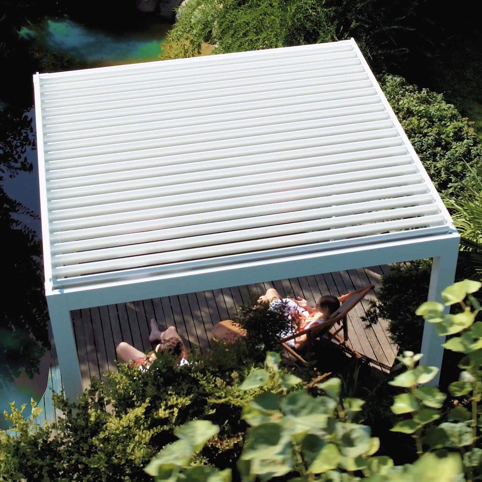 White louvered pergola with open louvers seen from above